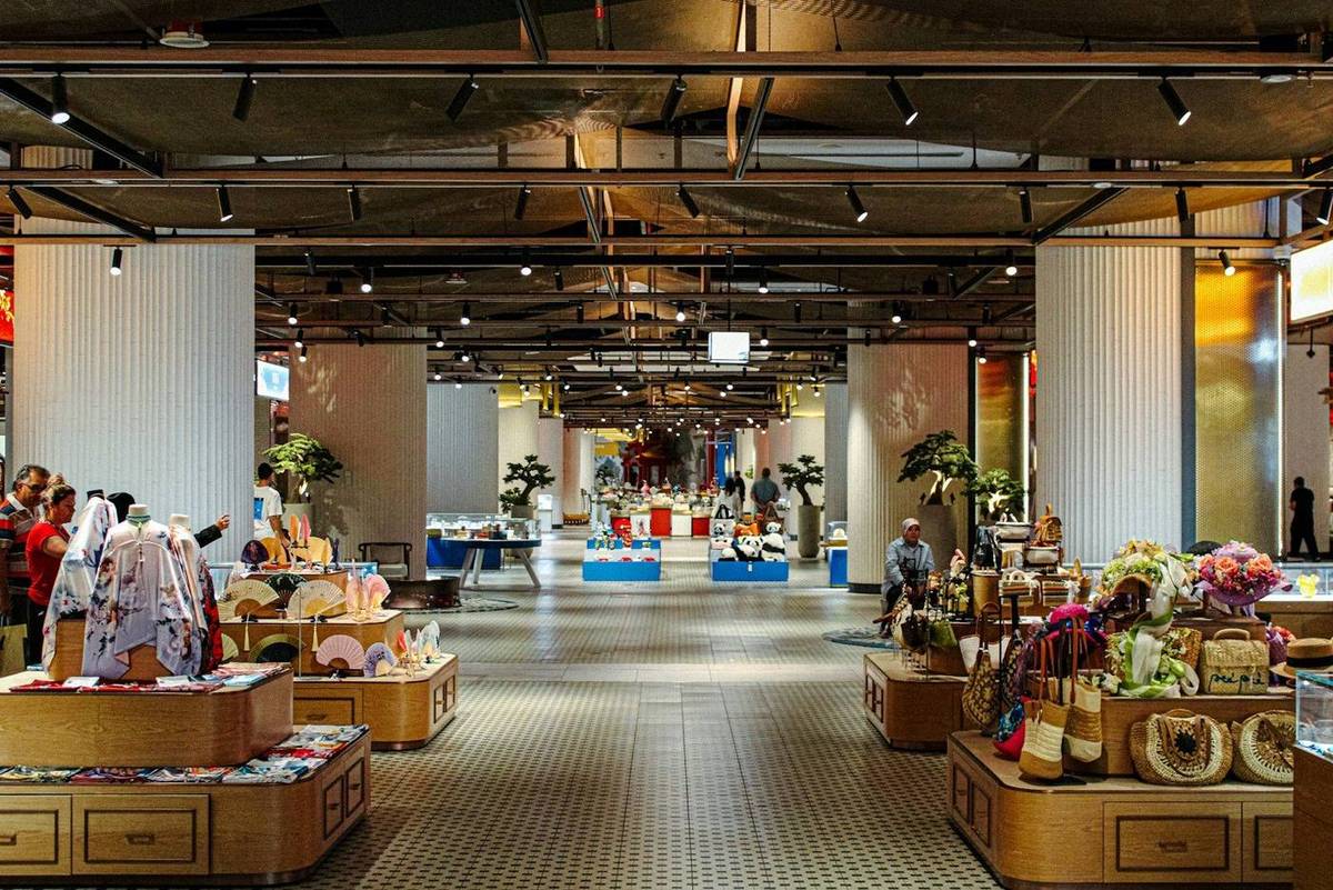 A bright retail interior with exposed services and open display floor