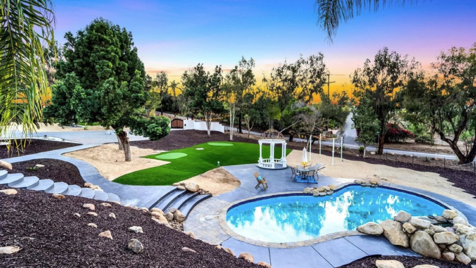 Backyard with pool & green