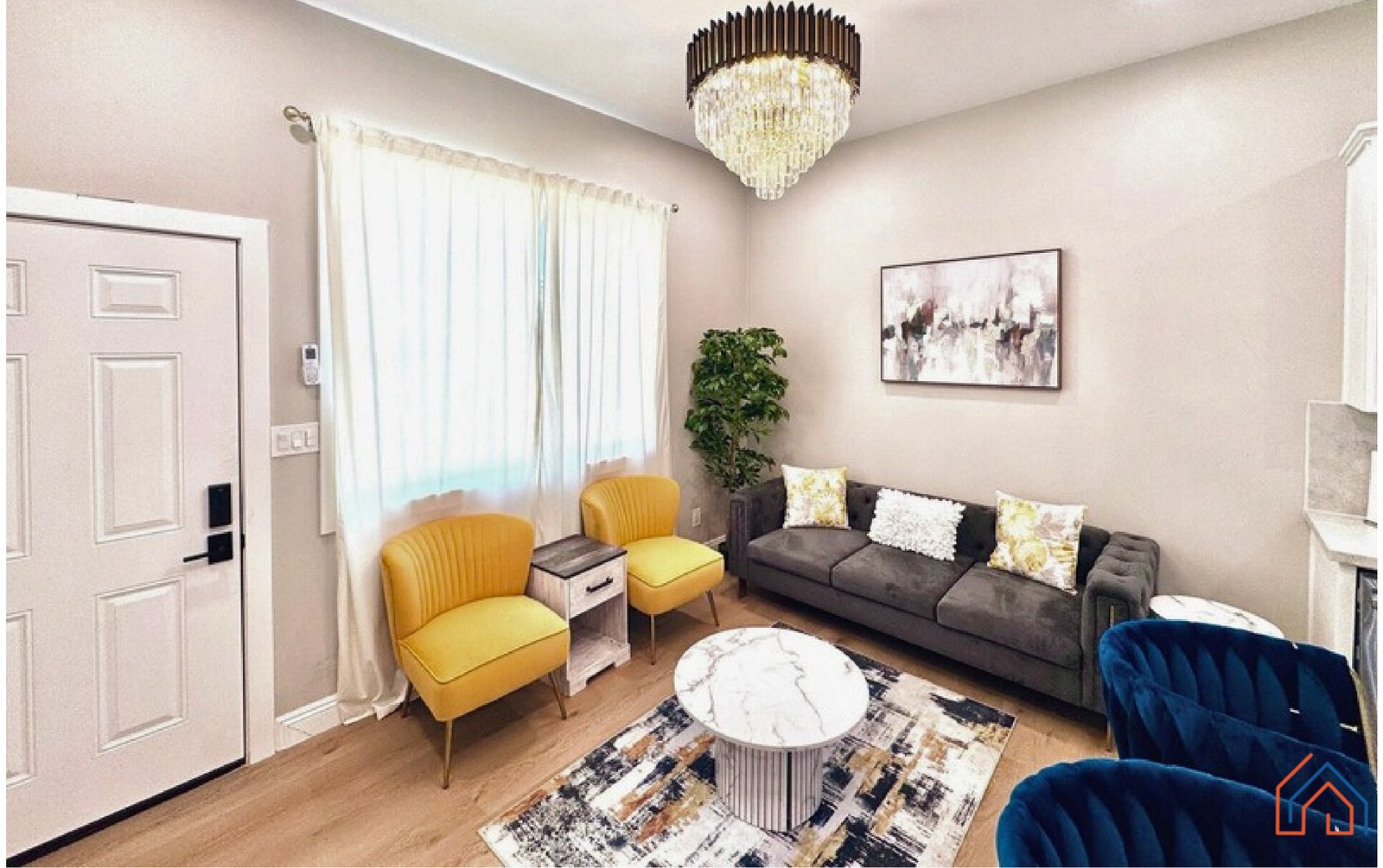 A compact furnished living room inside an existing home